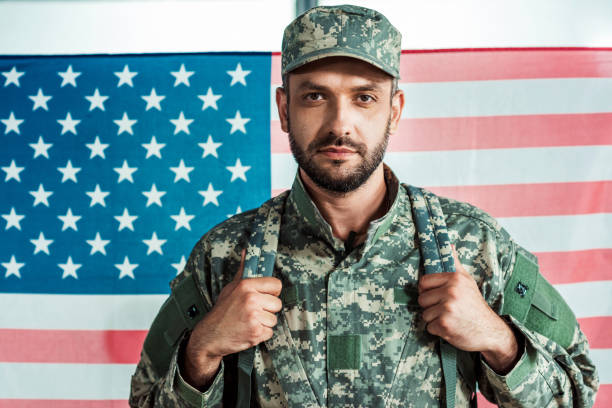 istock soldier in military uniform 902835594