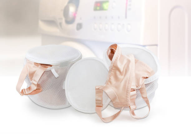 Two Laundry Bags Bras On Blurred Background Of Washing Machine Stock Photo  - Download Image Now - iStock