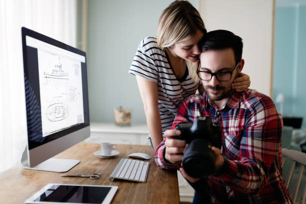 istock Young attractive designers working together from home 902843056