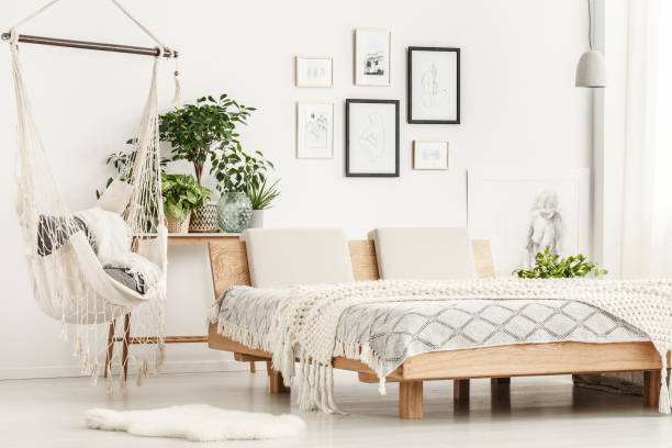 istock Wooden king-size bed in bedroom 902847266