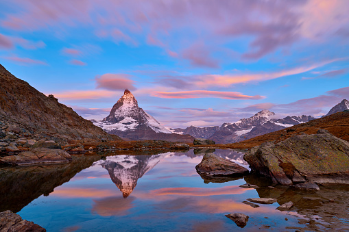 Swiss Alps's Matterhorn at sunrise in dramatic sky, Switzerland.