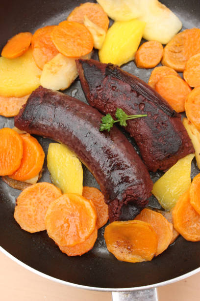 istock Black pudding fried with apples and sweet potatoes 902850330