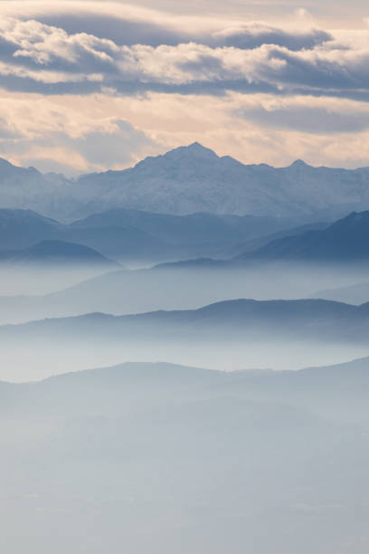istock Foggy mountain silhouette landscape 902850526
