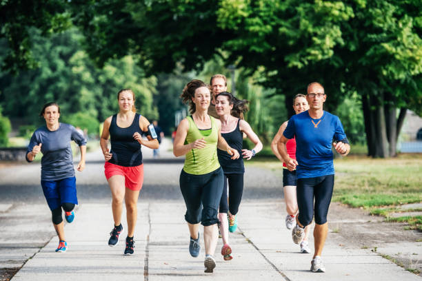 istock Amateur Athlete Group Jogging Alongside Each Other 902850922