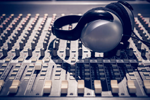 istock headphone on sound mixer, music background 902851270