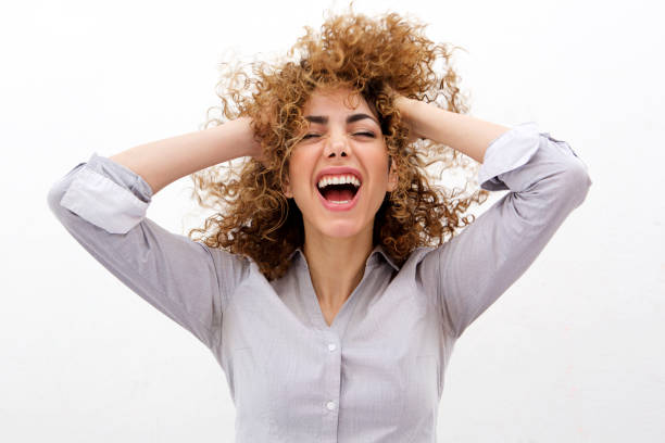 istock Young woman shouting with hands in hair 902856258