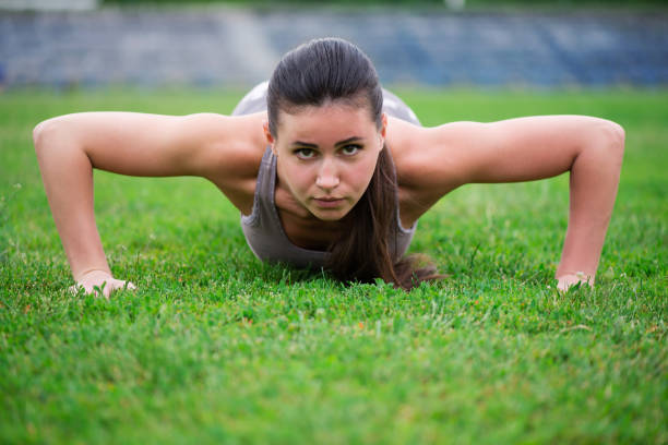 istock athletic girl is pushed out at the stadium 902856746