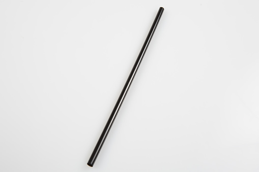 a black straw on a white background