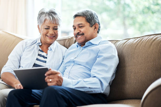 istock Catching up on technology now that they are retired 902863684