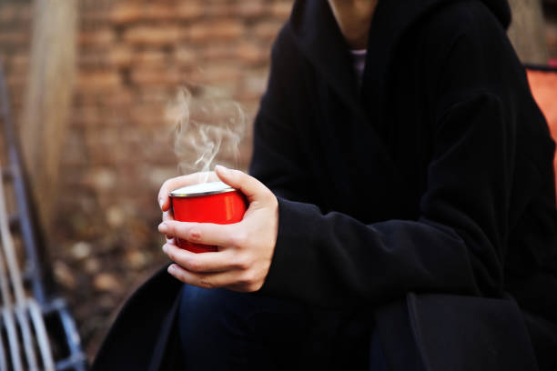 istock Woman hands holding tea cup on 902863798