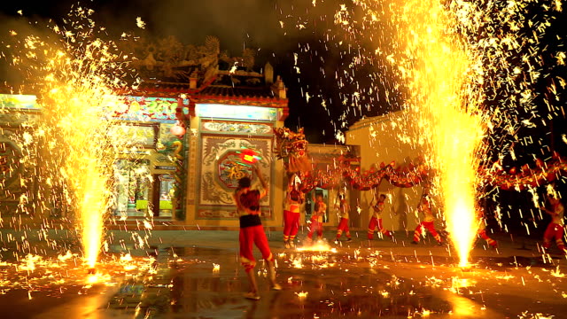 Dragon dance show with firework in the festival Chinese New Year in the night.