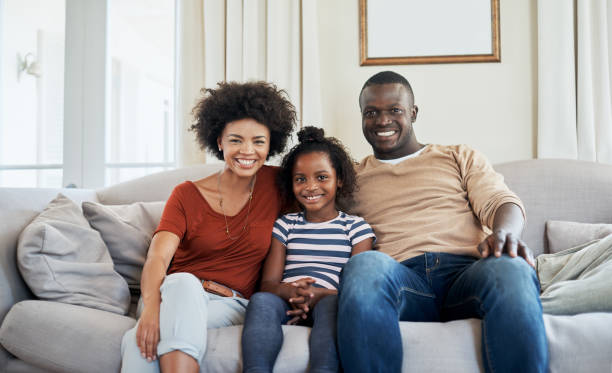 istock Mom and dad relaxing with big sis 902867460