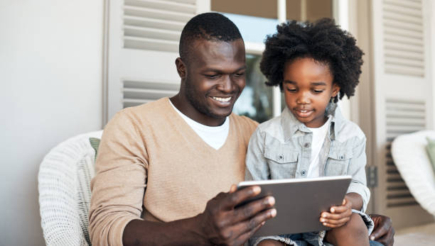 istock Let's see what games we can play together on the tablet 902867490