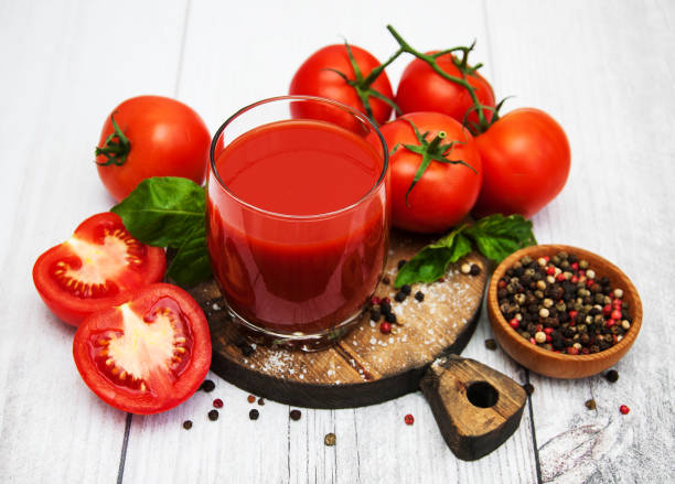 istock Glass with tomato juice 902870244