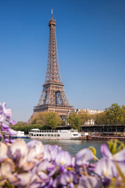 istock Eiffel Tower with boat during spring time in Paris, France 902871378