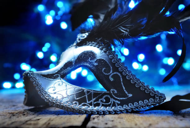 istock mask of carnival in blur lights 902875338