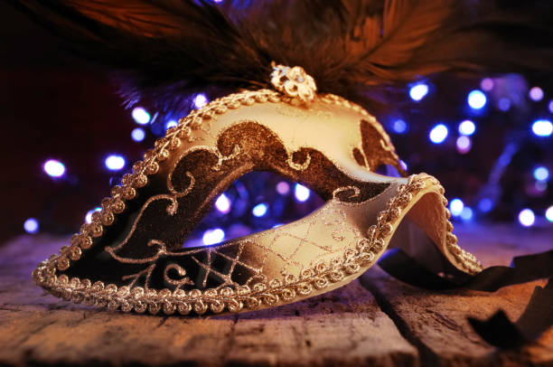 istock mask of carnival in blur lights 902875940