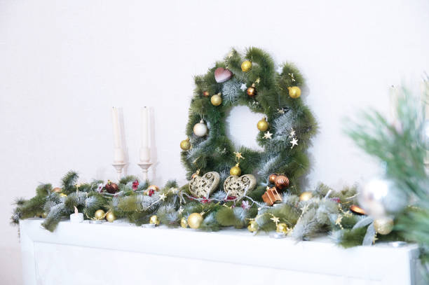 istock Christmas decorations with fir branches, candles, balls, heart figurines 902876652