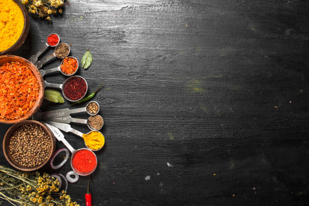 istock Spices and herbs with measuring spoons. 902876768