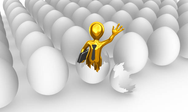 istock The golden businessman was born from egg. 902880234