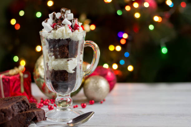 christmas background-homemade chokolate  dessert with wipped creame  , christmas decoration on white wooden table on background of  bokeh lights - wipped cream imagens e fotografias de stock