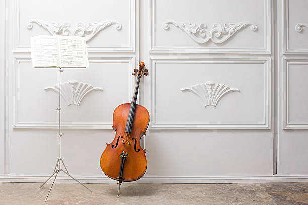 cello und notenständer - cello stock-fotos und bilder