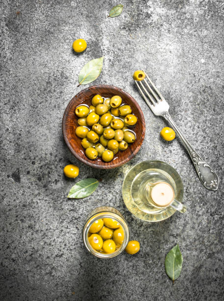 istock Pickled olives with olive oil. 902882782