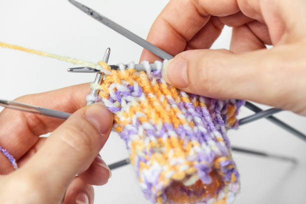 istock Young Woman Knitting 902882786