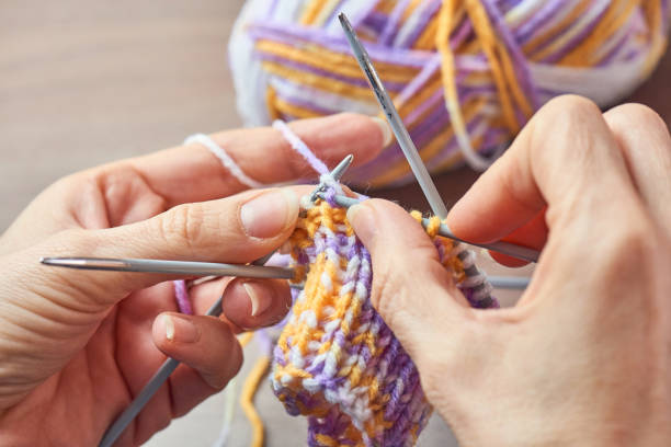 istock Young Woman Knitting 902882906