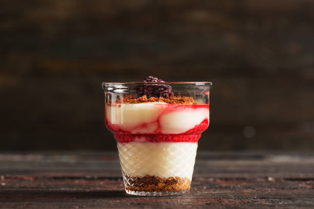 istock Delicious Pudding with Biscuit and Forest Fruits 902893940