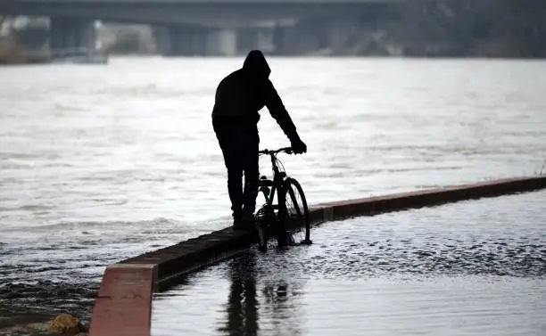 Flooded bike path after high water on a river in germany