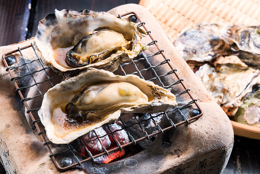 Charcoal grilling of oysters is one of the delicious way to eat oysters.