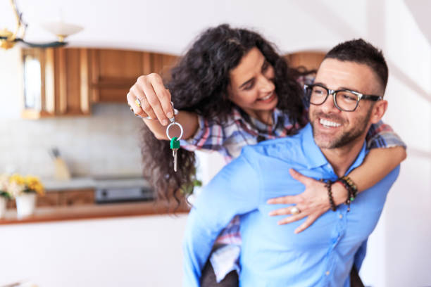 istock Happy couple moving in new home 902902084