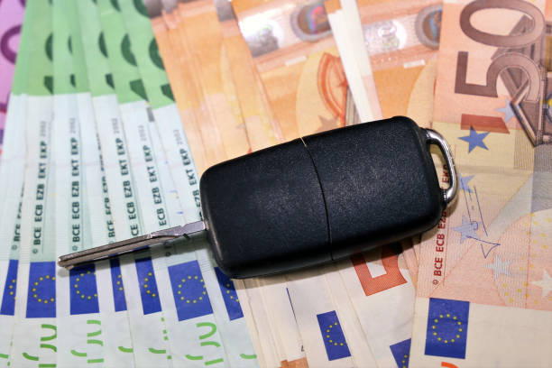 istock Euro bank notes and car key 902902094