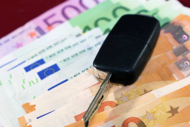 istock Euro bank notes and car key 902902130