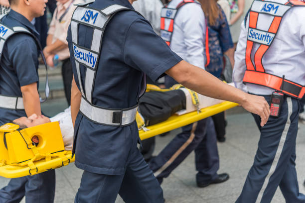 Preparedness for fire drill Bangkok, Thailand - November 30, 2017 : Many working people preparedness for fire drill or other disaster at office in Bangkok Thailand emergency response workplace stock pictures, royalty-free photos & images