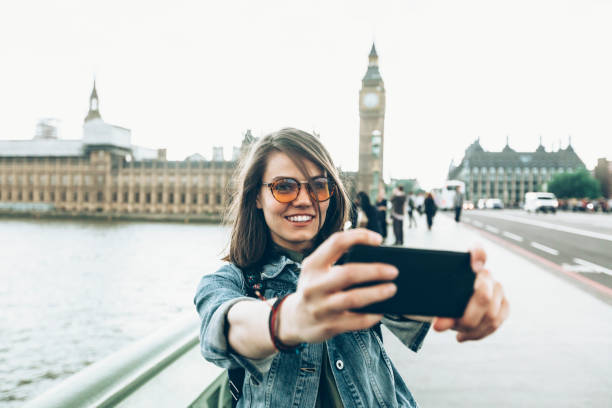 istock Cheerful tourist taking selfie 902904924