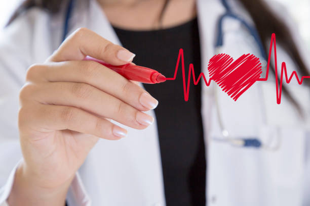 istock Doctor drawing ecg heartbeat chart 902905492