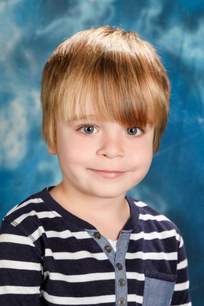 istock Portrait of a boy in a studio 902905580