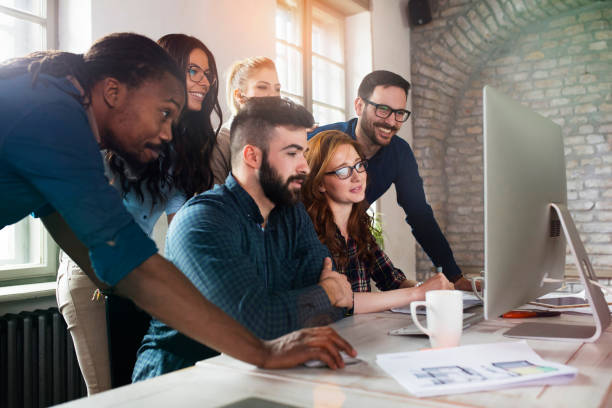 istock Group of young designers working as team 902913886