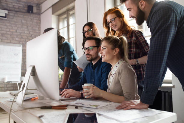 istock Group of young designers working as team 902913988