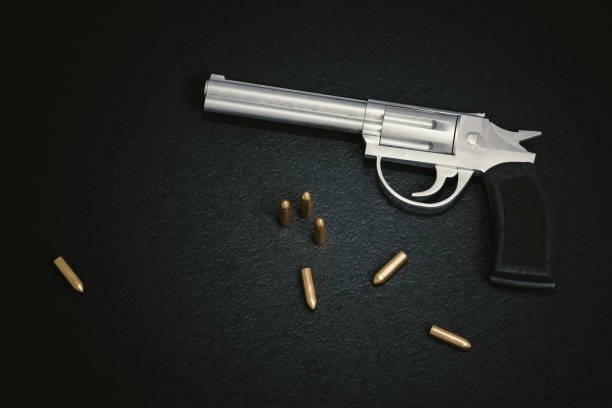 istock Crime scene. Gun with many bullets on black leather background. 3D rendered illustration. 902916524