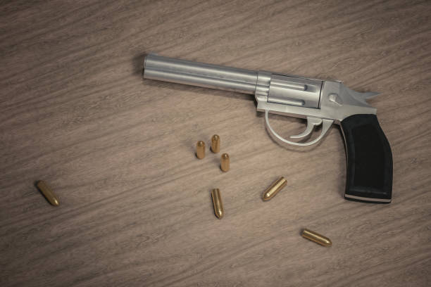 istock Crime scene. Gun with many bullets on wooden background. 3D rendered illustration. 902916618