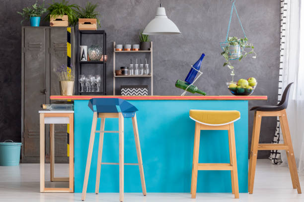 istock Wooden stools at kitchen island 902917554