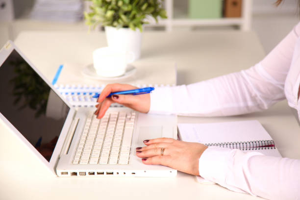 istock Young businesswoman working on a laptop 902920186