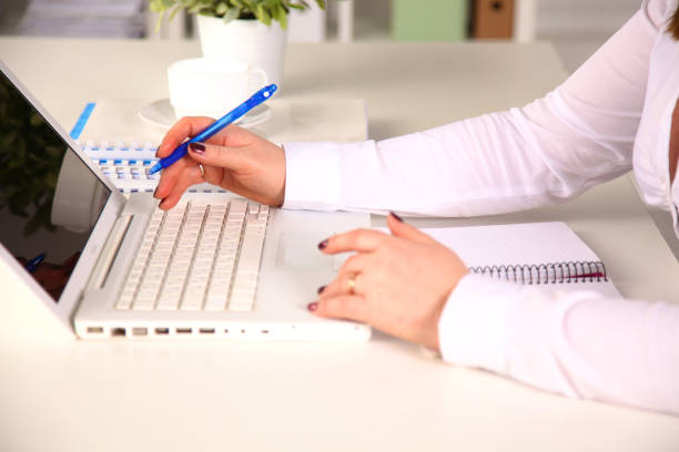 istock Young businesswoman working on a laptop 902920310