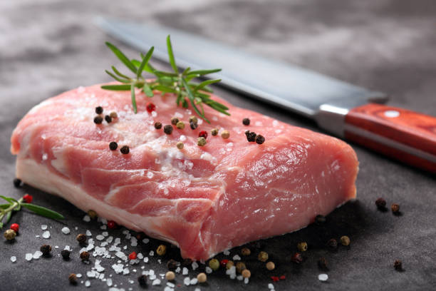 istock Raw pork loin with spices 902922236