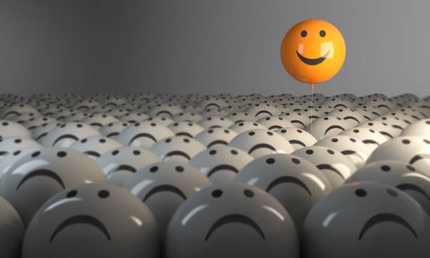 Standing Out From The Crowd With Smiling Sphere Smiling Sphere Balloon in the middle of grey crowd. ( 3d render )
 positive emotion stock pictures, royalty-free photos & images