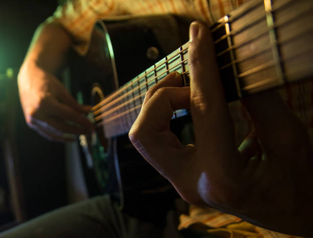 istock Musician man is playing the guitar 902925322