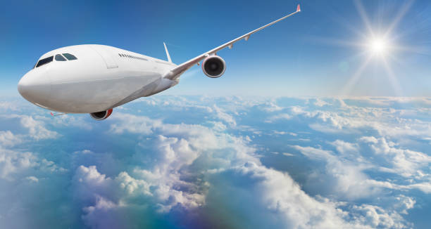 istock Commercial airplane flying above clouds 902926092